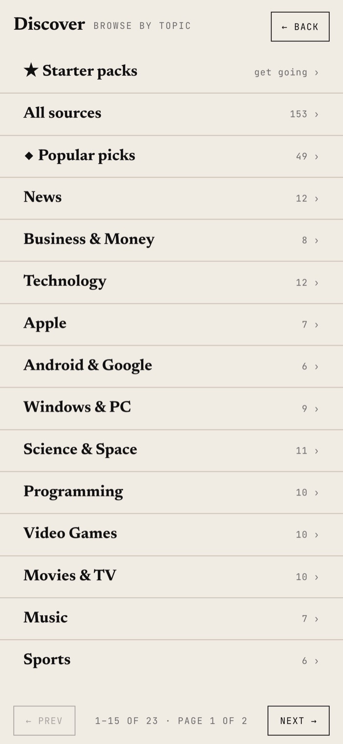 The Discover screen on a phone listing topic categories and starter packs of curated sources